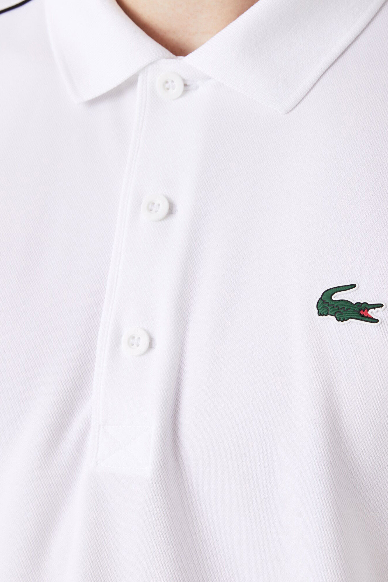Lacoste Polo con ribetes en contraste en los hombros y los extremos de las mangas
