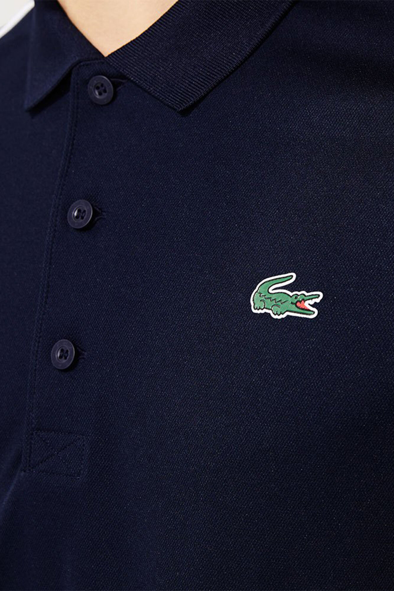 Lacoste Polo con ribetes en contraste en los hombros y los extremos de las mangas